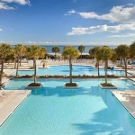 Main Pool separated by Palm Trees Grand Dunes Marriott Resort